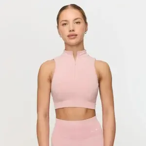 GymBeam Bezešvá sportovní podprsenka Fierce Baby Pink - S obraz