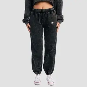GymBeam Dámské tepláky Aura Washed Black - XS obraz