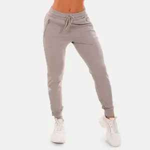 GymBeam Dámské tepláky TRN grey - XS obraz