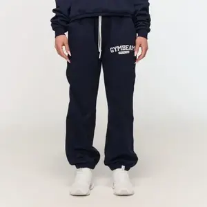 GymBeam Dámské tepláky Varsity Blue - XS obraz