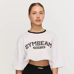 GymBeam Dámské tričko Oversized Varsity White - XS obraz