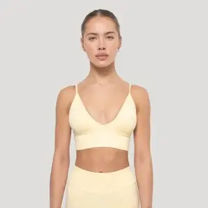 GymBeam Sportovní podprsenka Luma Butter Yellow - S obraz