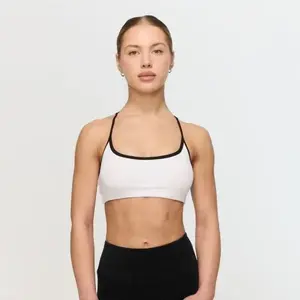 GymBeam Sportovní podprsenka Varsity White - XS obraz