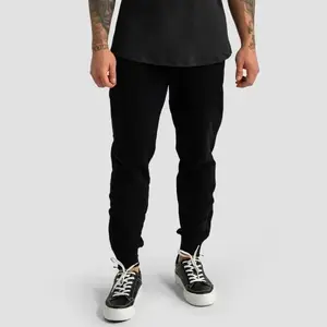 GymBeam Tepláky Limitless Black POUZE XL (VÝPRODEJ) obraz
