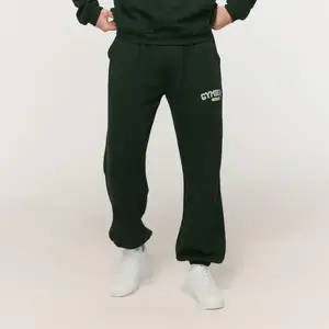 GymBeam Tepláky Varsity Green - XXL obraz