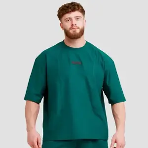 GymBeam Unstoppable Green pánské oversized tričko - XXXL obraz